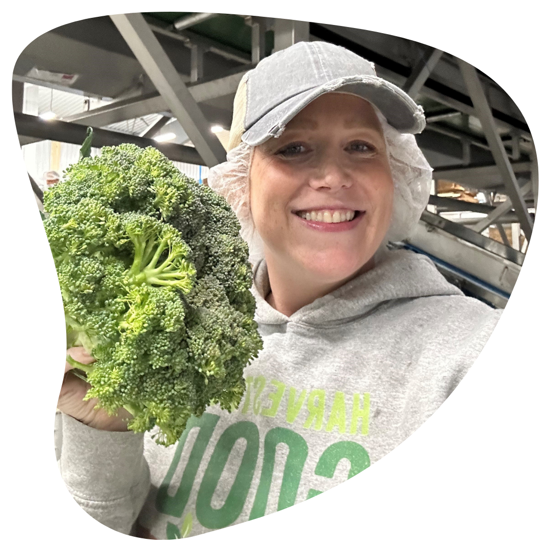 Melissa Motejunas at WR Allen processing facility with a broccoli crown